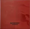 A red box with embossed imagery and text. Produktbild-Vorschau
