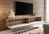 A modern TV stand with a wall-mounted television above it, in a living room setting. Náhľad obrázku produktu