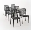 A group of black chairs with a decorative backrest are arranged on a white background. Anteprima dell’immagine prodotto