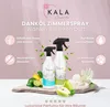 Two spray bottles of room spray are displayed on a piece of wood with fruit and a flower. The background is a soft pink gradient. Produktbild-Vorschau