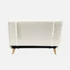 The back view of a creme-colored sofa with wooden legs. Produktbild-Vorschau