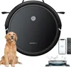 A black robot vacuum cleaner is shown with a golden retriever dog sitting next to it. A smartphone displaying a cleaning app and a remote control are also visible, along with a close-up of the vacuum's mopping attachment. Náhled obrázku produktu