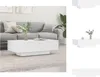 A white coffee table is placed in front of a gray sofa in a living room. Náhled obrázku produktu