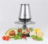 A food chopper with surrounding ingredients like avocado, tomatoes, lemons, garlic, and chili peppers. Produktbild-Vorschau