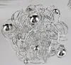 A close-up shot of a decorative silver wire ball with small silver spheres. Produktbild-Vorschau