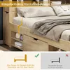 A close-up view of a wooden bed frame with a mattress and bedding, highlighting a snap-in design feature. Voir les images du produit