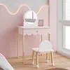 A child's vanity table and chair set in a pink room. Produktbild-Vorschau