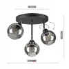 A black ceiling light fixture with three adjustable, smoked glass globe shades, shown with dimensions indicated. Produktbild-Vorschau
