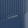 A close-up view of the textured surface of a blue suitcase with the 'travelite' logo embossed on it. Náhľad obrázku produktu