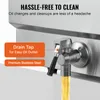 Close-up of a drain tap on a stainless steel appliance, with yellow oil flowing out. Anteprima dell’immagine prodotto