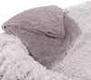 A close-up view of two fluffy blankets, one folded on top of the other. Produktbild-Vorschau