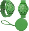A collage of a green smartwatch and its round case. Produktbild-Vorschau