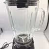 A close-up shot of a blender jar with measurement markings. Voir les images du produit