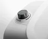 A close-up shot of a white appliance with a gray rotary dial and a temperature indicator. Produktbild-Vorschau