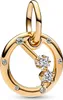 A close-up studio shot of a gold-colored charm with clear stones. Podgląd zdjęcia produktu
