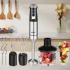A kitchen counter with a hand blender and its accessories, along with a container of berries and a glass of fruit salad. Anteprima dell’immagine prodotto