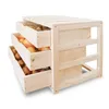 A wooden storage unit with three drawers filled with vegetables. Produktbild-Vorschau