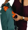 A person is placing an orange water bottle into a teal backpack. Produktbild-Vorschau