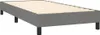 A close-up, eye-level shot of a gray upholstered bed frame with wooden slats. Voir les images du produit
