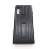 A black Samsung phone case with a kickstand is shown against a white background. Produktbild-Vorschau
