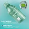 A bottle of Redken Amino-Mint shampoo is shown with a small beaker of water and a mint leaf in the background. Text overlays highlight product benefits. Produktbild-Vorschau