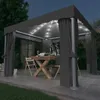 An outdoor pavilion set up for dining at night, with lights and curtains. Produktbild-Vorschau