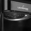 Close-up of the interior of a black appliance, showing a heating element and branding. Podgląd zdjęcia produktu