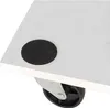 Close-up of a black circular pad on the corner of a white surface, with a metal and black wheel visible underneath. Náhľad obrázku produktu