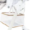 A close-up view of a white baby high chair with a white mesh basket and brown trim. Anteprima dell’immagine prodotto