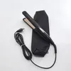 A black hair straightener with gold plates and a black storage pouch is laid out on a white surface. Náhľad obrázku produktu