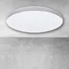 A modern, round LED ceiling light is mounted on a concrete ceiling. Podgląd zdjęcia produktu
