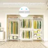 An organized wardrobe with clothes hanging on racks and shelves. Podgląd zdjęcia produktu