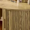 A close-up view of a wooden desk with a ribbed cabinet door and a handle. Produktbild-Vorschau