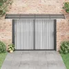 A door awning is installed above a sliding glass door on a brick wall. Náhled obrázku produktu