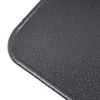 A close-up view of the textured surface and rounded edge of a dark gray metal plate. Produktbild-Vorschau