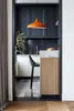 A modern kitchen nook with a pendant light, bar stool, and cabinetry. Produktbild-Vorschau