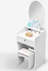 A white vanity table with a mirror and a stool, decorated with various cosmetic products. Voir les images du produit