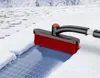 A snow brush is being used to clear snow from a solar panel in a snowy environment. Anteprima dell’immagine prodotto