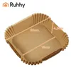 A stack of square, brown paper liners for an air fryer or oven, with dimensions indicated by orange lines and text. Náhled obrázku produktu