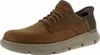 A single brown Skechers shoe is shown against a white background. Voir les images du produit