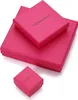 Three pink jewelry boxes of varying sizes are stacked and arranged on a white background. Produktbild-Vorschau