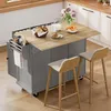 A kitchen island with a breakfast setting, including bread, croissants, and milk, with two bar stools in front. Náhled obrázku produktu