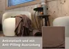 A cozy living room scene with a blanket draped over an armchair, a side table with candles, and a close-up inset of the blanket's texture. Produktbild-Vorschau