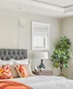 A bedroom scene with a bed, nightstand, and a window. Produktbild-Vorschau