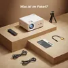 A projector and its accessories are arranged on brown cardboard platforms. Podgląd zdjęcia produktu