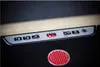 Close-up of a control panel and a red circular logo. Podgląd zdjęcia produktu