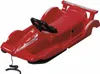 A red plastic sled designed to look like a race car, shown from a slightly elevated front-left angle against a white background. Produktbild-Vorschau