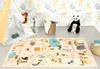 A child's play area with a teepee, a play mat with a road and animal theme, and stuffed animals. Produktbild-Vorschau