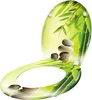 A toilet seat with a bamboo and stone art design. Produktbild-Vorschau