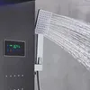 A close-up of a modern shower panel with a digital display showing temperature and time, and a showerhead spraying water. Náhled obrázku produktu